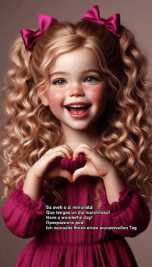 a little girl is making a heart shape with her hands