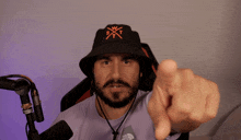a man with a beard wearing a black hat and a shirt that says north face