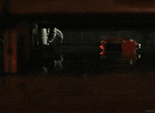 a large monster is walking through a store with a red exit sign in the background