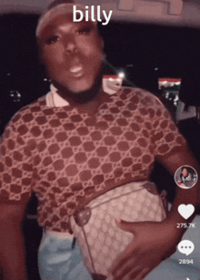a man in a gucci shirt is holding a purse and the word billy is on his face