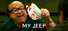 a man is holding a pile of money that is on fire and says my jeep ..