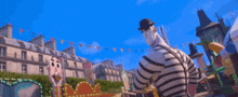 a man in a striped shirt and a hat is pointing at the camera