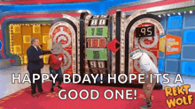 a man in a cowboy hat is standing in front of a game show board .