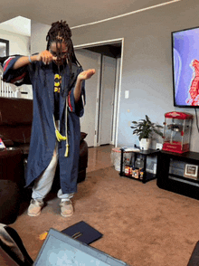 a person in a living room with a popcorn machine and a tv