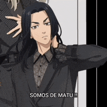 a man in a suit has the words somos de matu written on the bottom