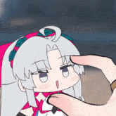 a cartoon character with white hair and a pink headband is being held by a hand