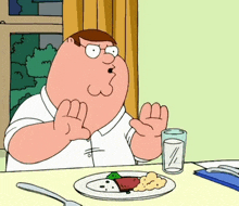 peter griffin from family guy is sitting at a table with a plate of food and a glass of milk
