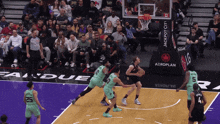 a basketball game is being played in front of an lg advertisement