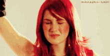a woman with red hair has a picture of herself on tumblr