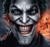 a close up of the joker 's face with a huge smile on his face .