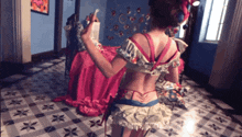 a woman taking a selfie in a room with a checkered floor