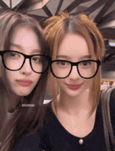 two girls wearing glasses are posing for a picture and one of them has the hashtag @the benyapa