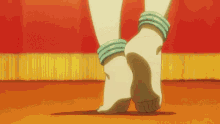 a woman 's feet are shown with bracelets around her wrists