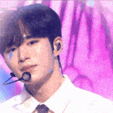 a close up of a man wearing a microphone with the word comeback on the bottom