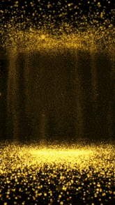 a lot of gold sparkles are falling from the ceiling on a black background .