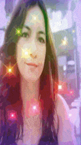 a woman 's face is shown in a pixelated image with sparkles coming out of her eyes