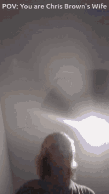 a picture of chris brown 's wife with a light shining on her face