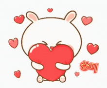 a cartoon rabbit is holding a large red heart surrounded by smaller hearts ..