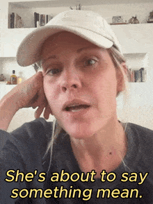 a woman wearing a hat says she 's about to say something mean ..