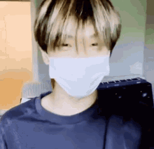 a close up of a person wearing a mask .