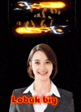 a woman in a suit is smiling and the words lobak big are visible behind her