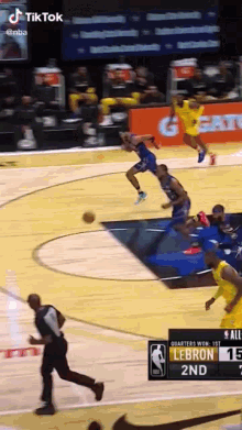 a basketball game is being played on a court with gatorade advertisements