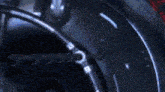 a close up of a machine with a blurred background and a few lights on it .