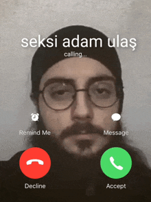 a man wearing glasses and a black hat is being called by seks adam ulas