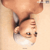 ariana grande 's sweetener album cover shows a woman laying upside down