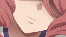 a close up of a girl 's face with a smile