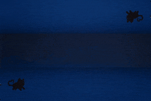 a group of people standing in front of a blue wall