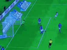 a group of soccer players are playing on a field with a banner behind them that says " allianz "