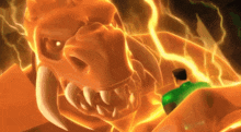 a man in a green shirt is standing in front of an orange monster with horns