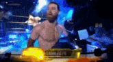a shirtless wrestler named sami zayn is standing in a wrestling ring
