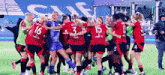 a group of female soccer players are huddled together on the field and one of them has the number 3 on her jersey