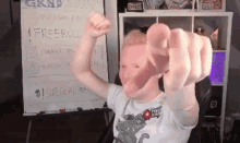 a person giving a thumbs up in front of a whiteboard that says freeroll