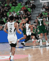 a basketball player with the number 2 on the back of his shirt