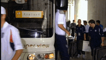 a white bus with the word england on it