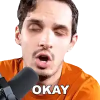 a man with his eyes closed is talking into a microphone and says okay