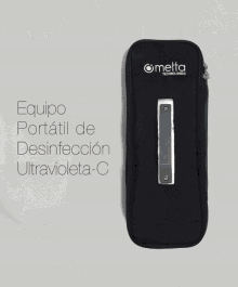 a black bag that says melta technologies sits next to a silver device