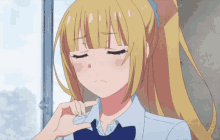 a girl with blonde hair and a blue bow tie