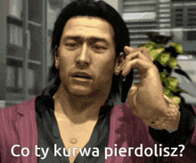 a man talking on a cell phone with the words " co ty kurwa pierdolisz " on the bottom