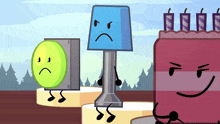 a blue lamp with an angry face is standing next to a green ball and a red cake