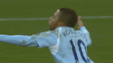 a soccer player wearing a number 11 jersey is being lifted by another player