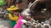 a stuffed donkey and a stuffed wolf are standing next to each other .