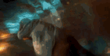 a close up of a person 's face with a blurred background .