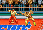 a video game shows two wrestlers in a ring with p2 and p1 in the background