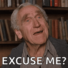 an elderly man says excuse me in a library