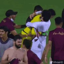 a group of soccer players with one wearing a shirt that says " whdahd "