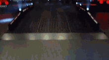 a blurry picture of a stage with a sign that says enxt on it